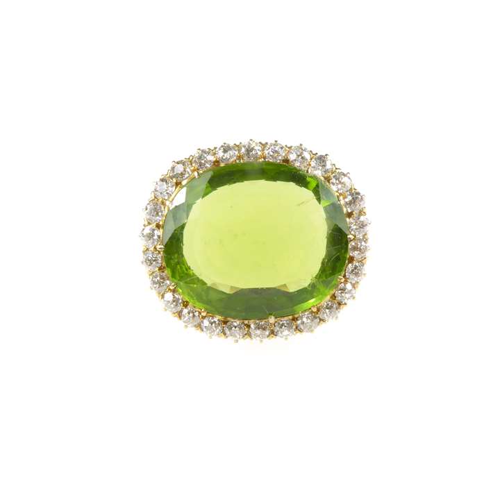 Single stone peridot and diamond cluster brooch